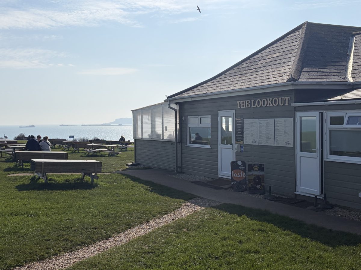 Exterior shot of The Lookout Cafe its outside seating area with sea views