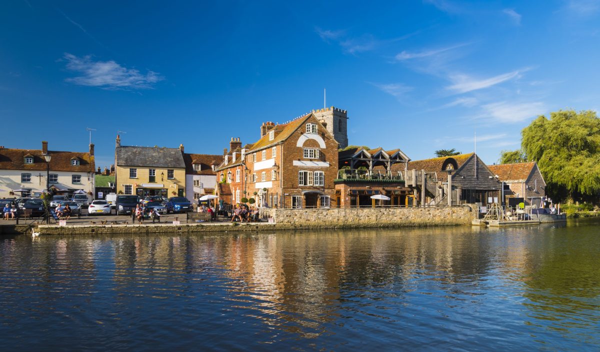 View across the River Frome towards Wareham Quay and The Old Granary pub in Wareham, Dorset.