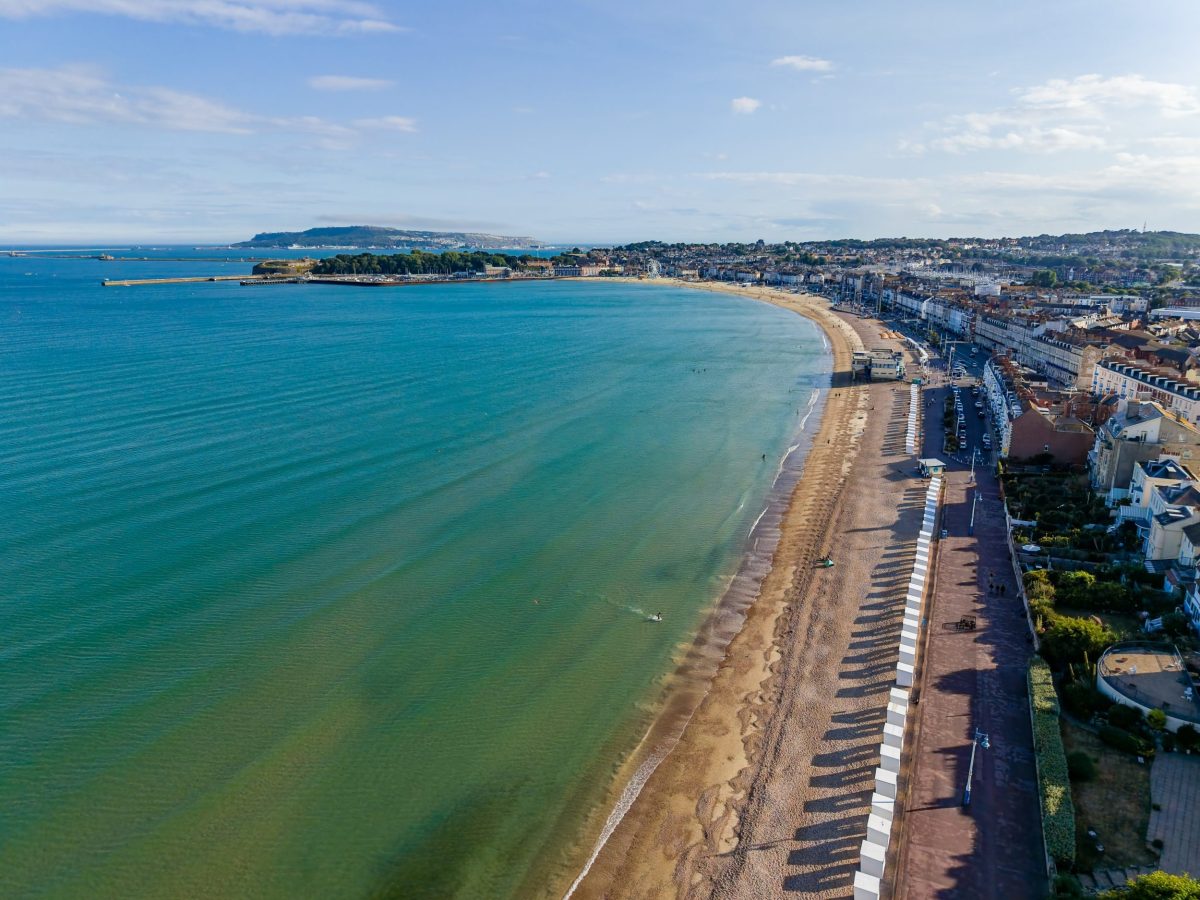 Aerial view of weymouth's sandy beach and clear blue sea on Dorset's Jurassic Coast