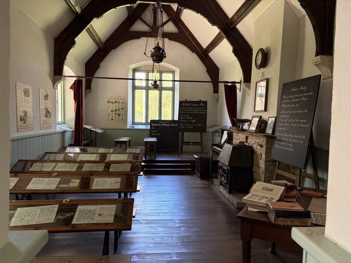 Interior of the school museum at Tyneham Village in Dorset showing historic classroom displays