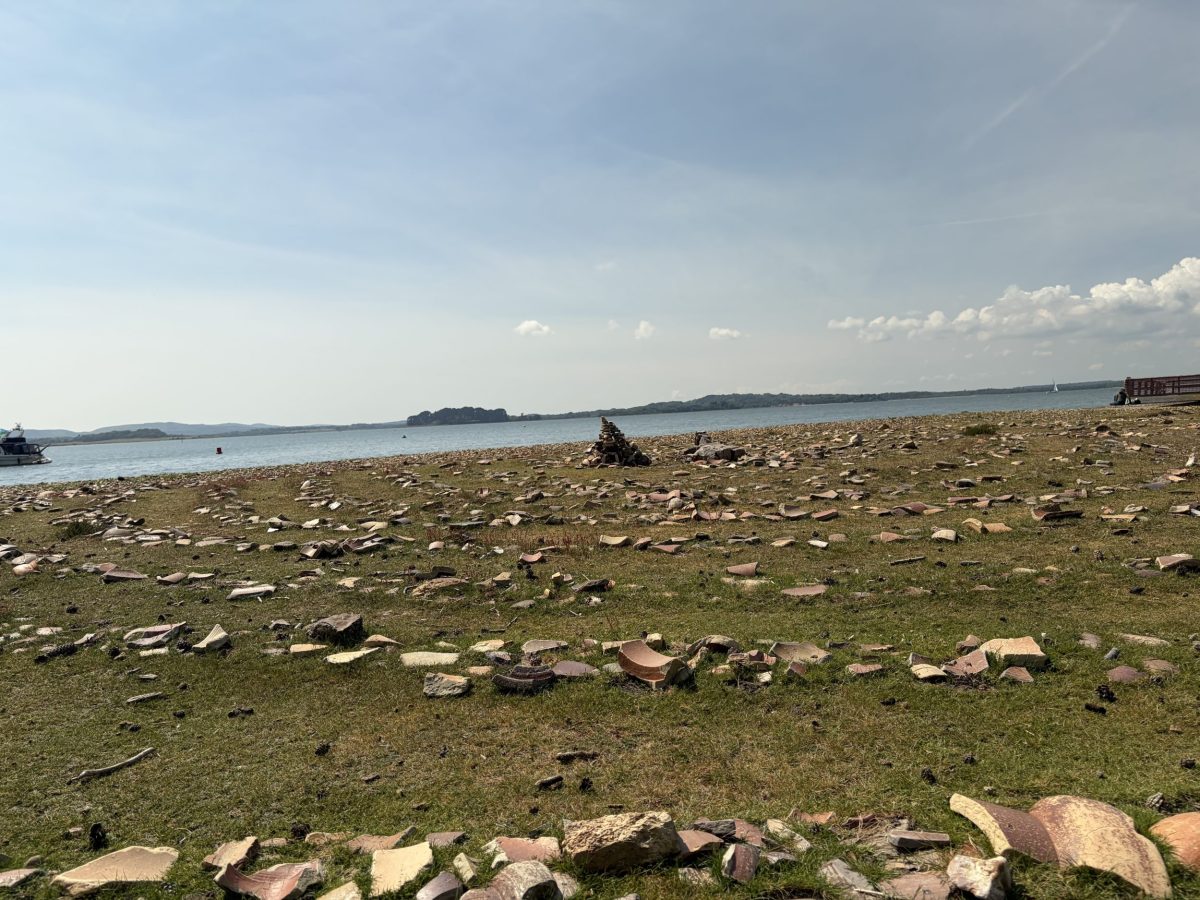 Pottery Pier shoreline on Brownsea Island with old ceramic fragments.
