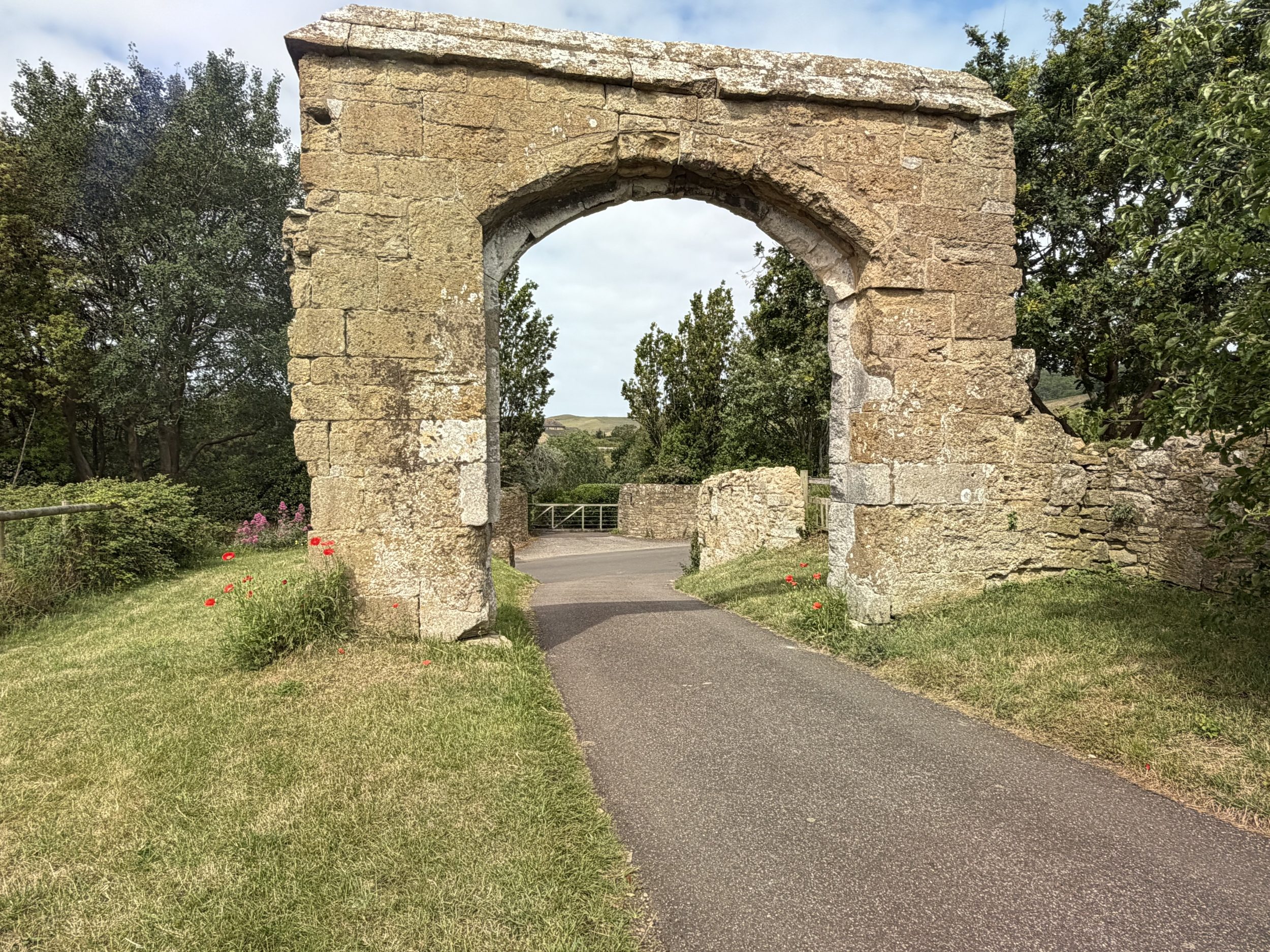 Medieval stone archway at the historic Abbotsbury Abbey ruins in Dorset