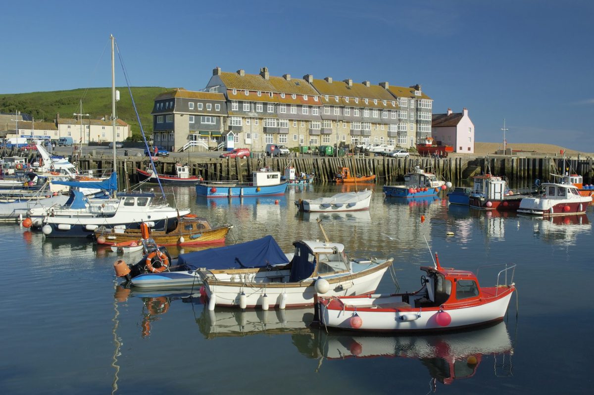 Fishing boats moored in West Bay Harbour on Dorset's Jurassic Coast