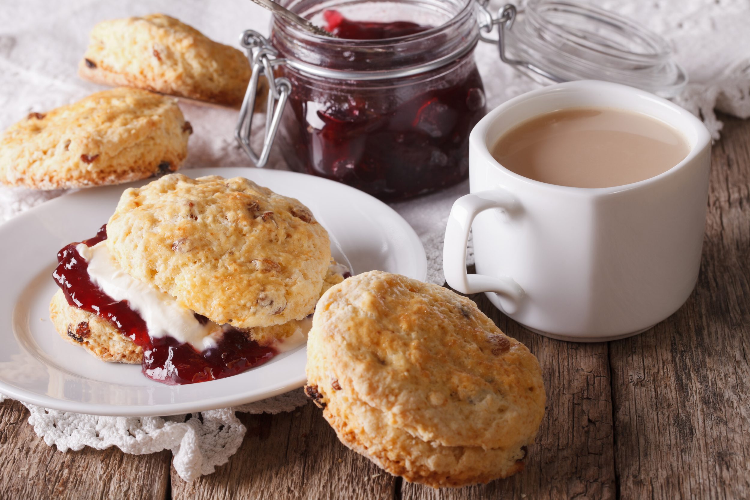 Traditional Dorset cream tea with scones, jam and cream served at a café in Abbotsbury
