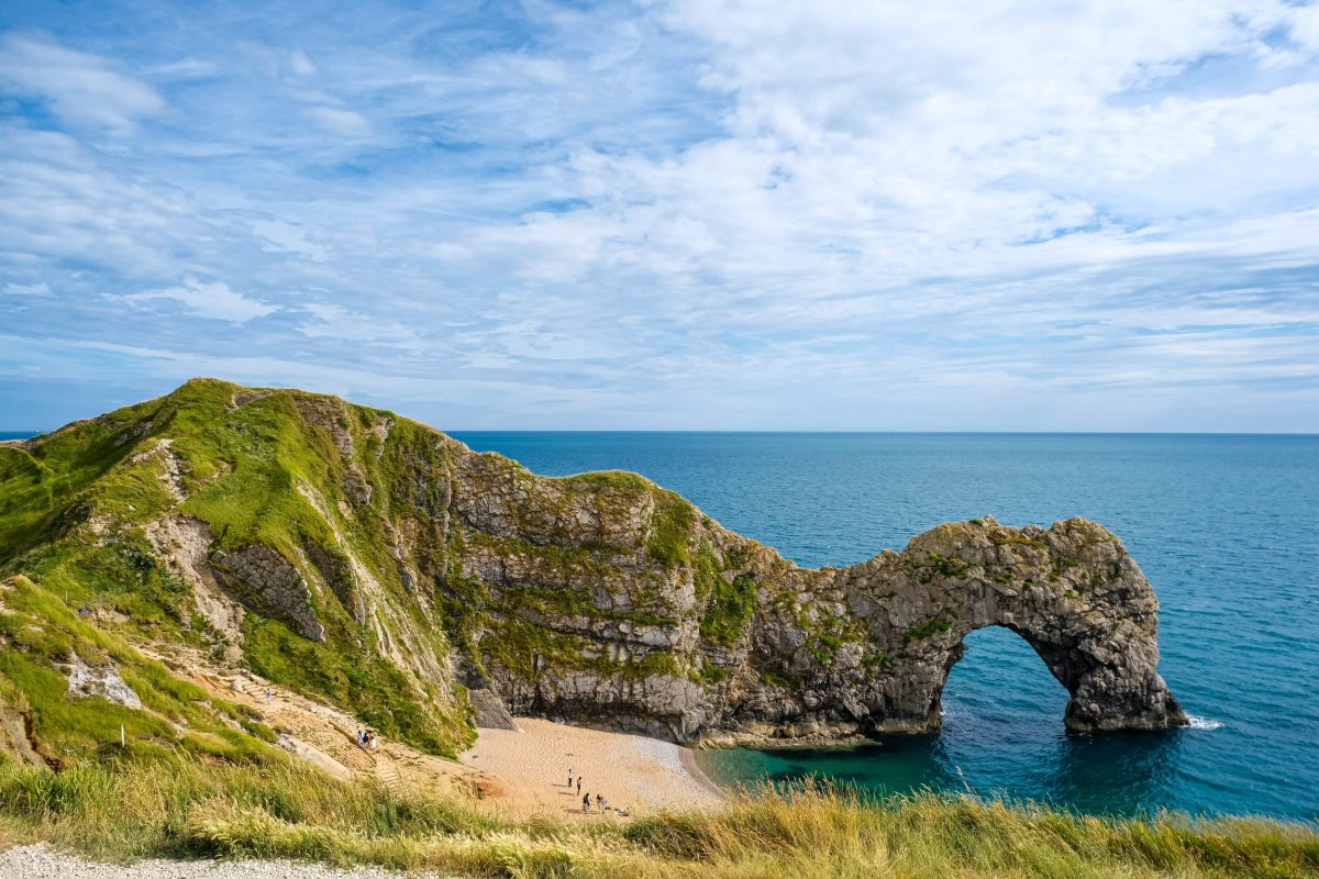 Durdle Door on the Dorset coast during a sunny summer day