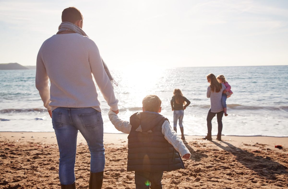 Family enjoying a last-minute holiday on the Dorset coast