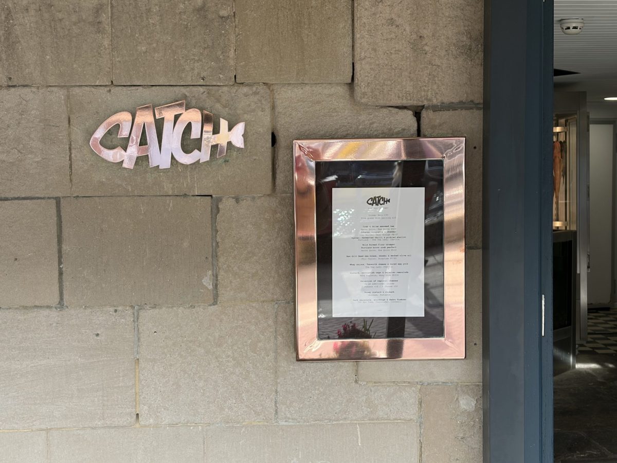 Catch at the Old Fish Market sign and menu at the Michelin Guide restaurant on Weymouth Harbour.