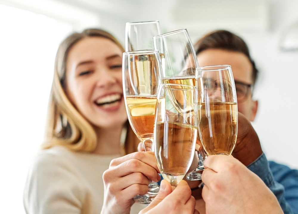 Family and friends raising glasses during a celebration, representing special occasions at Silverlake Estate in Dorset.