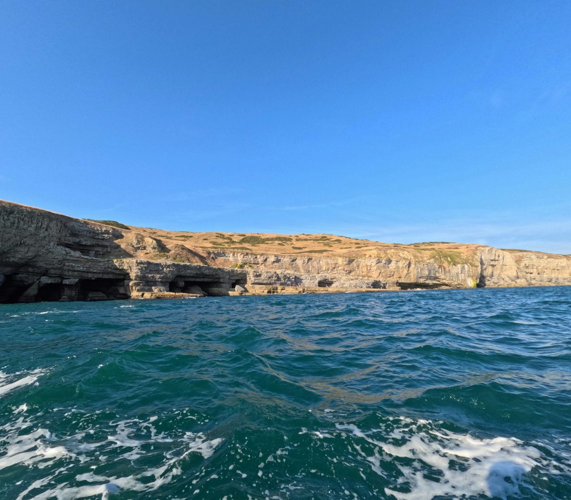 View of the Jurassic Coast cliffs from a RIB boat in Dorset