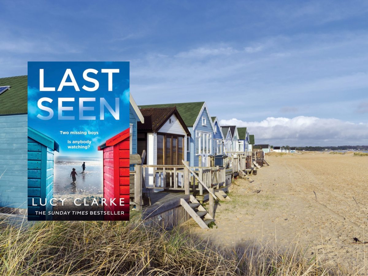 Beach huts at Mudeford Spit alongside the cover of Lucy Clarke's novel Last Seen, inspired by Dorset's coastline.