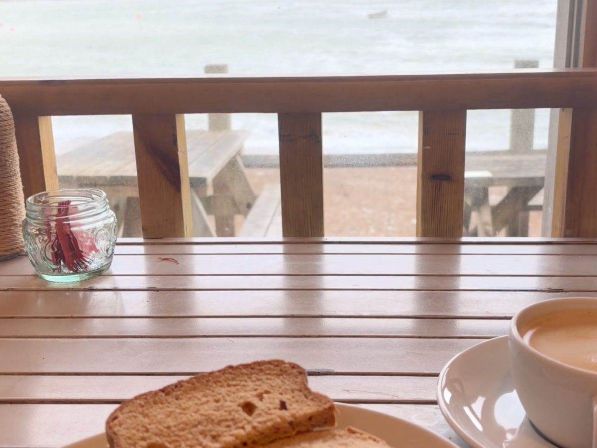 Seaview table, cup of coffee looking out towards Lulworth Cove.