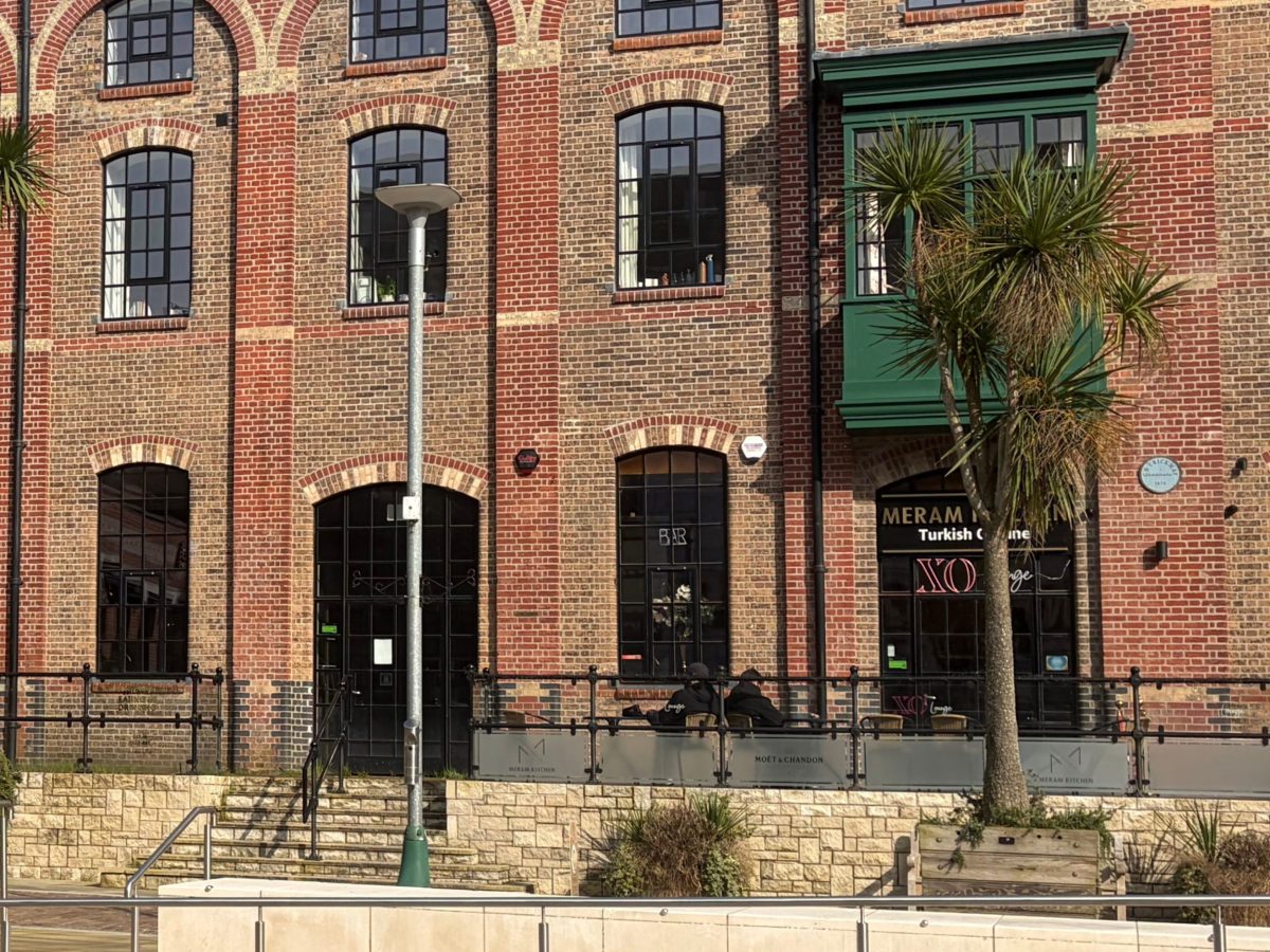Entrance to Meram Kitchen Turkish restaurant in a red-brick building at Brewery Square, Dorchester