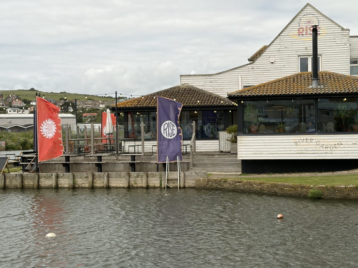 Rise restaurant beside the River Brit in West Bay, surrounded by the Dorset countryside.