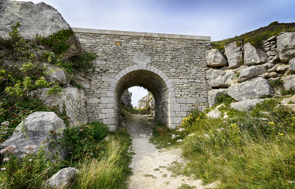 Historic stone bridge at Tout Quarry Sculpture Park on Portland, Dorset.