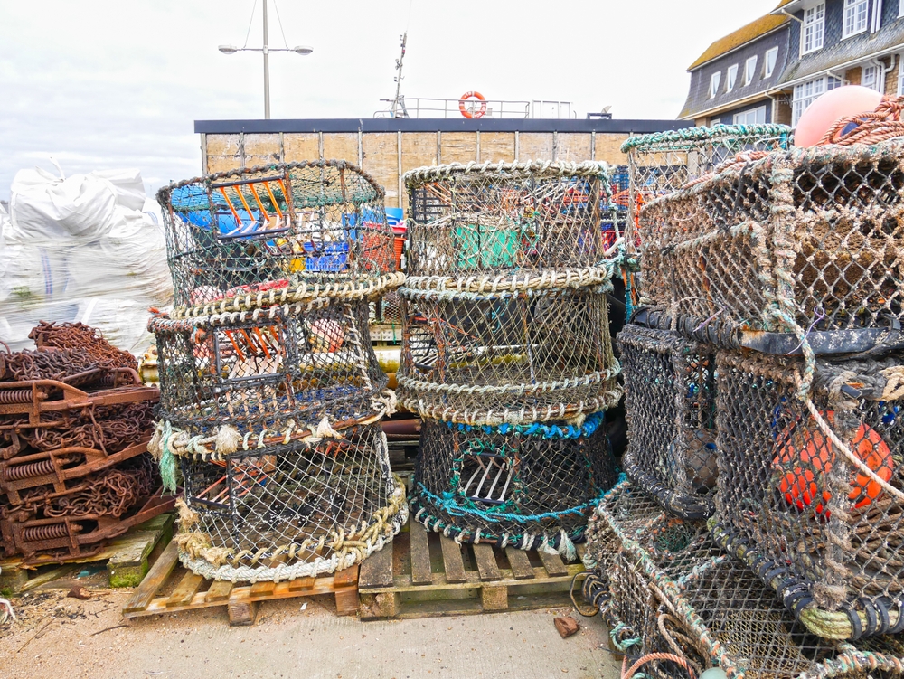 Traditional lobster pots reflecting West Bay's long fishing heritage on Dorset's Jurassic Coast.