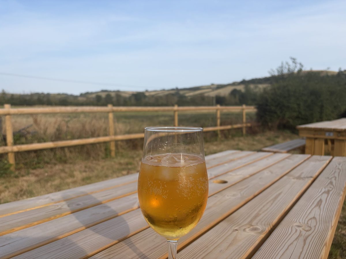 Pint on a table at The Springhead pub in Sutton Poyntz overlooking the Dorset countryside