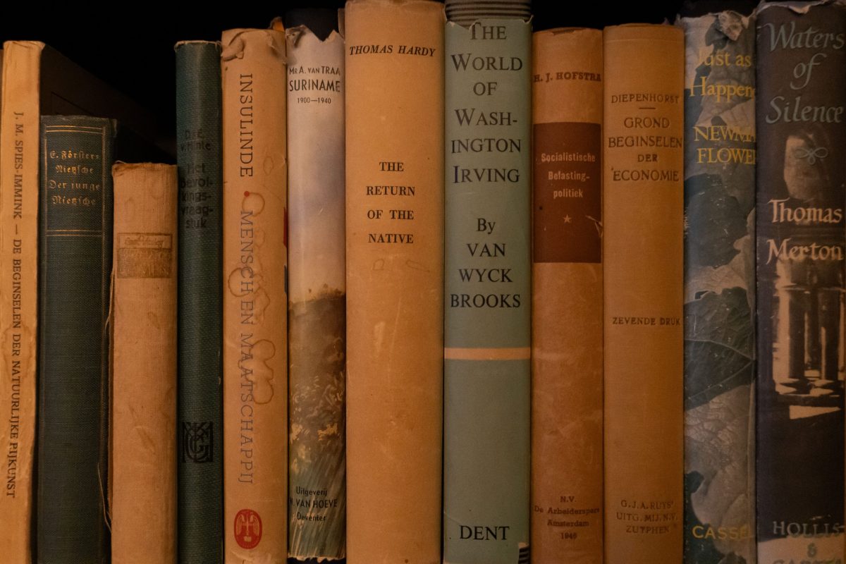 Collection of old books with a Thomas Hardy book in the centre
